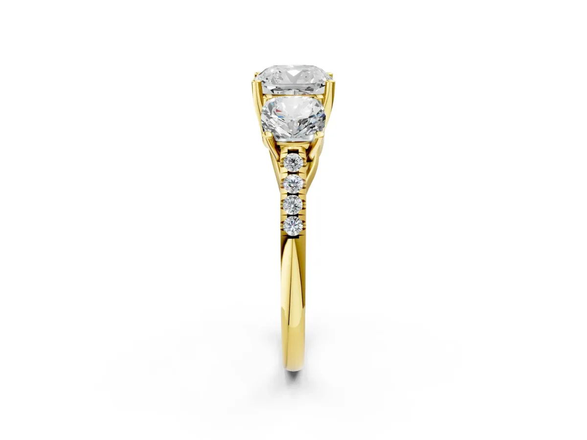 Fancy Black Three-Stone Cushion Cut Diamond Ring with Round Pavé Band and Prong Setting Yellow gold