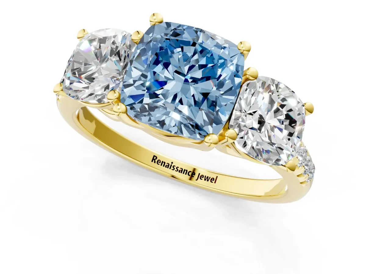 Fancy Blue Three-Stone Cushion Cut Diamond Ring with Round Pavé Band and Prong Setting Yellow gold