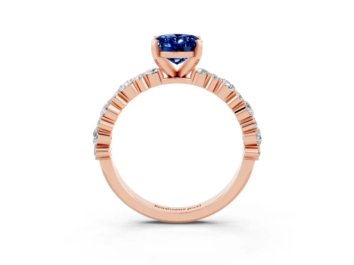 Oval Cut Blue Sapphire Side Stone Solitaire Ring with Round and Four-Prong Setting Rose gold