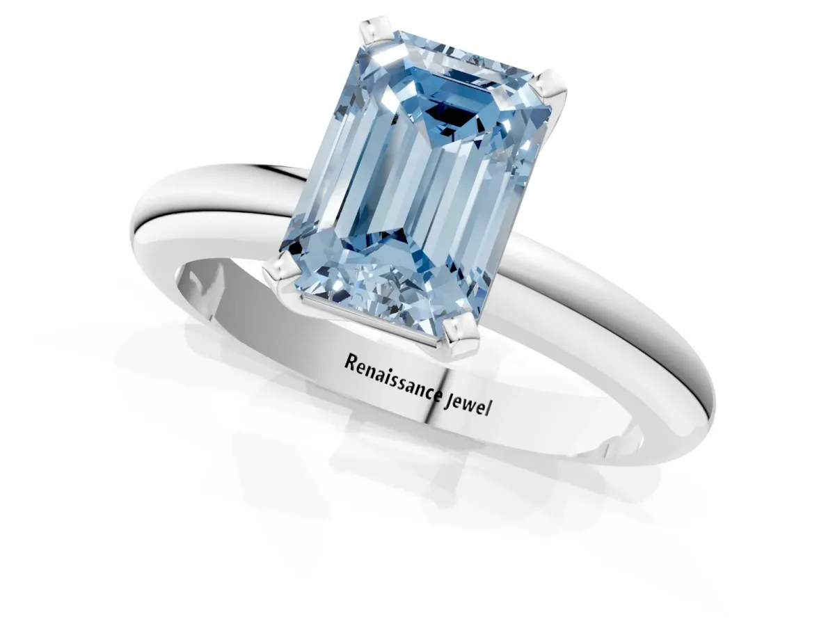 Fancy Blue Emerald Cut Diamond Solitaire Engagement Ring with Round Band and Four-Prong Setting White gold