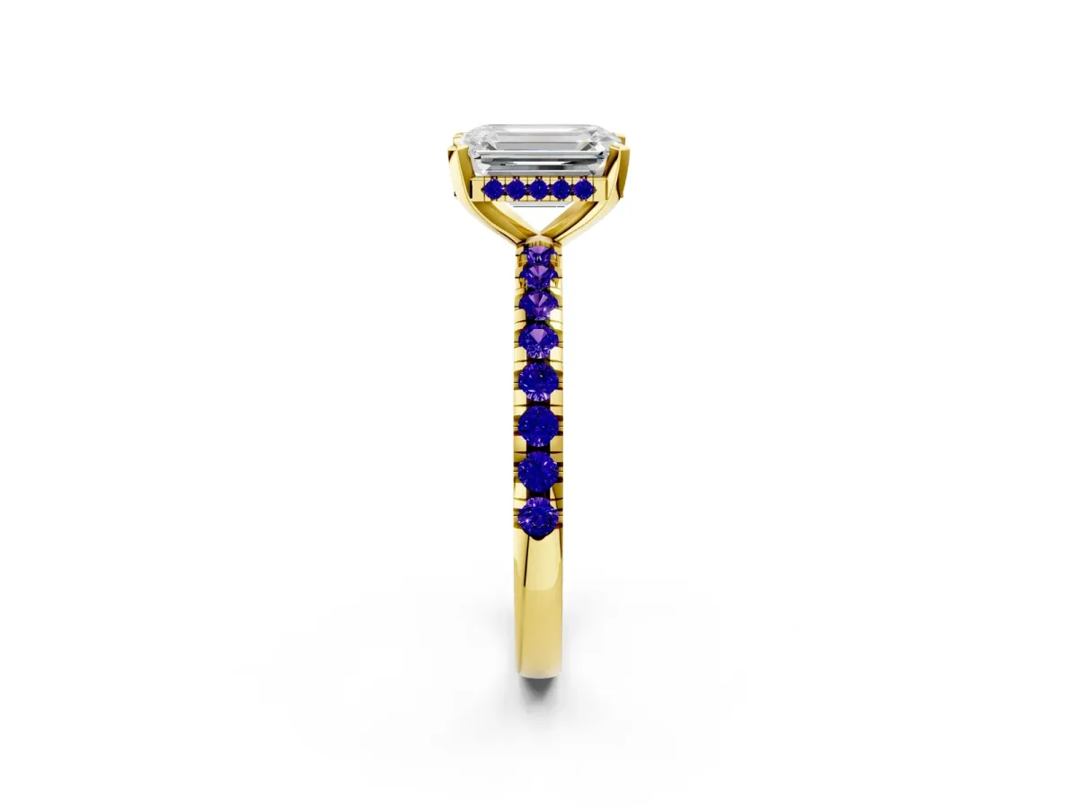 Emerald Cut Diamond Solitaire Ring with Round Tanzanite Pavé Band and Four-Prong Setting Yellow gold