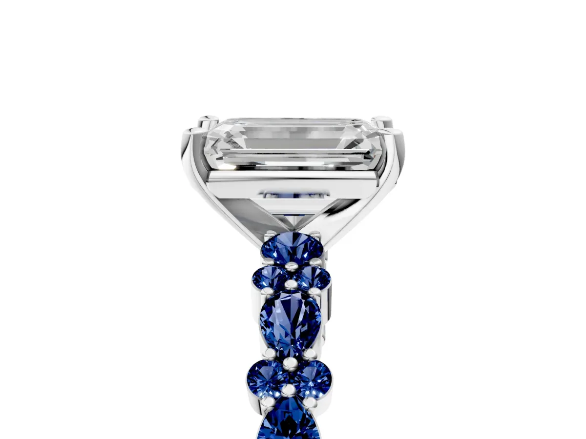 Emerald Cut Diamond Side Stone Solitaire Ring with Round Blue Sapphire and Four-Prong Setting Silver