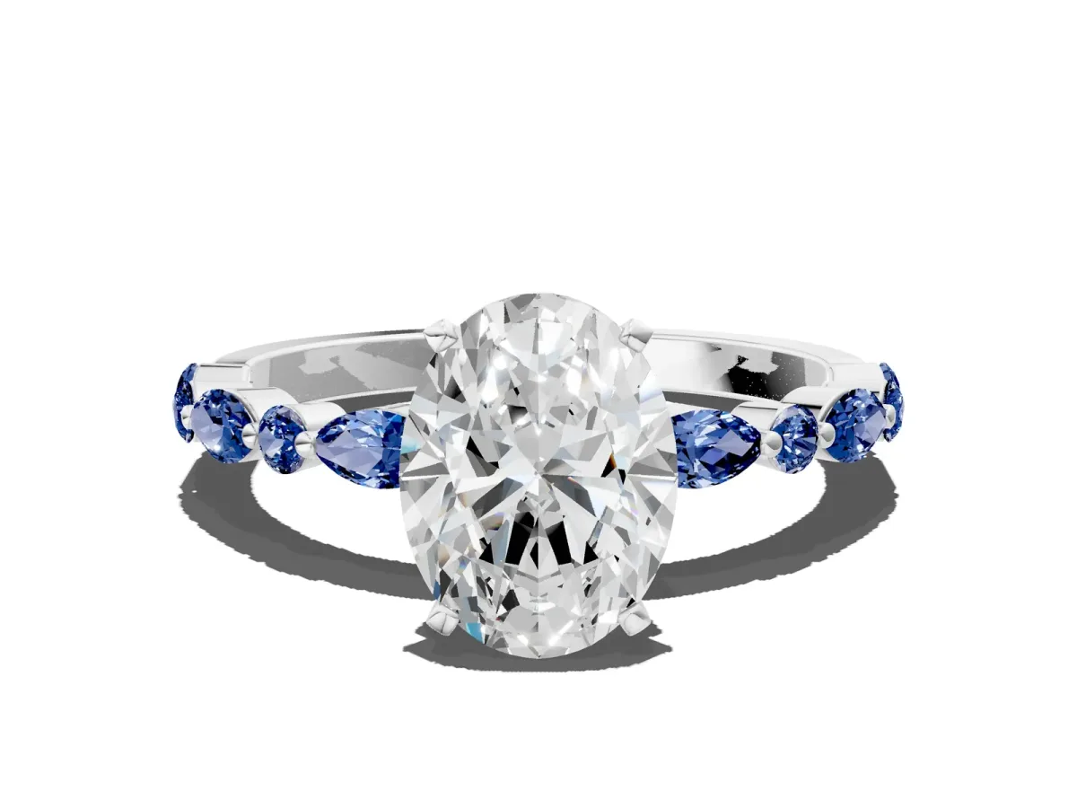 Oval Cut Diamond Ring with Marquise and Round Blue Sapphire Side Stones and Four-Prong Setting Silver