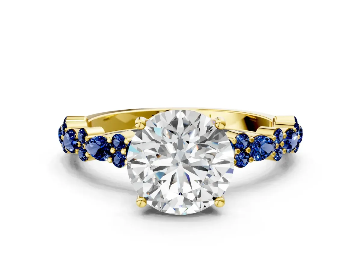 Round Cut Diamond Side Stone Solitaire Ring with Round Blue Sapphire and Four-Prong Setting Yellow gold
