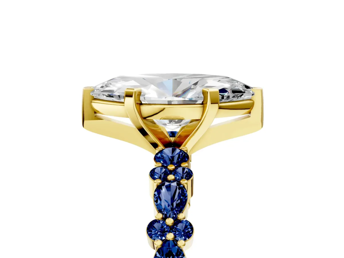 Marquise Cut Diamond Side Stone Solitaire Ring with Round Blue Sapphire and Four-Prong Setting Yellow gold