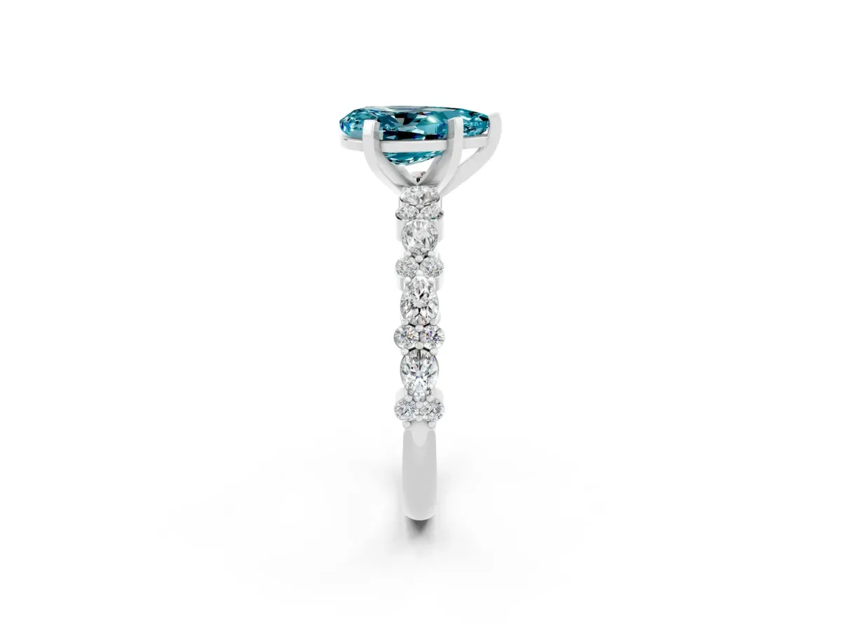 Pear Cut Blue Topaz Side Stone Solitaire Ring with Round and Four-Prong Setting White gold