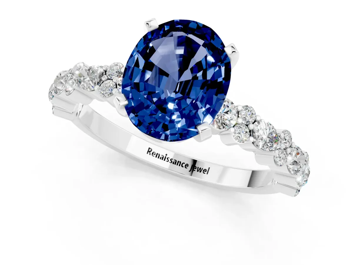 Oval Cut Blue Sapphire Side Stone Solitaire Ring with Round and Four-Prong Setting White gold