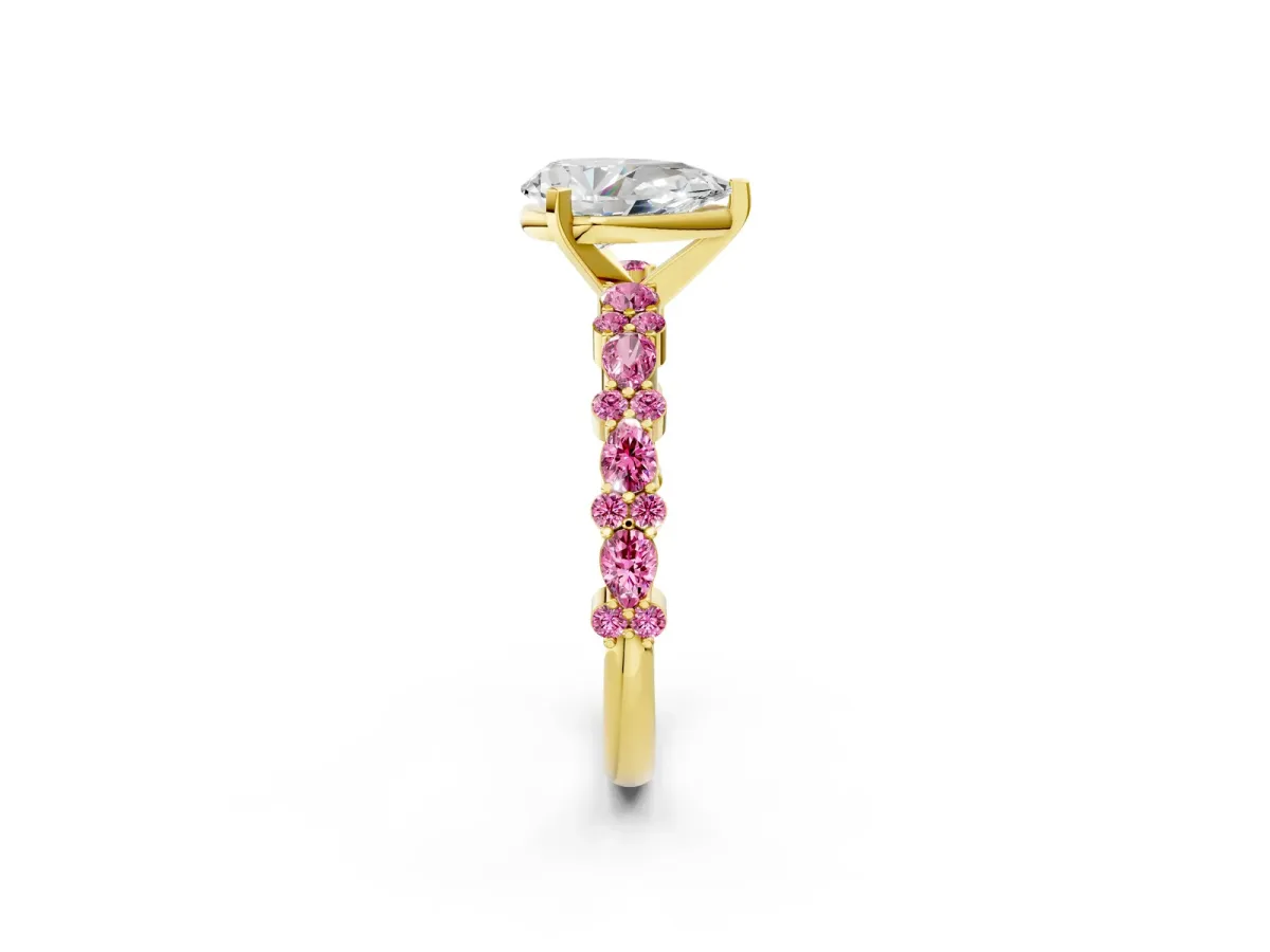 Pear Cut Diamond Side Stone Solitaire Ring with Round Pink Sapphire and Four-Prong Setting Yellow gold