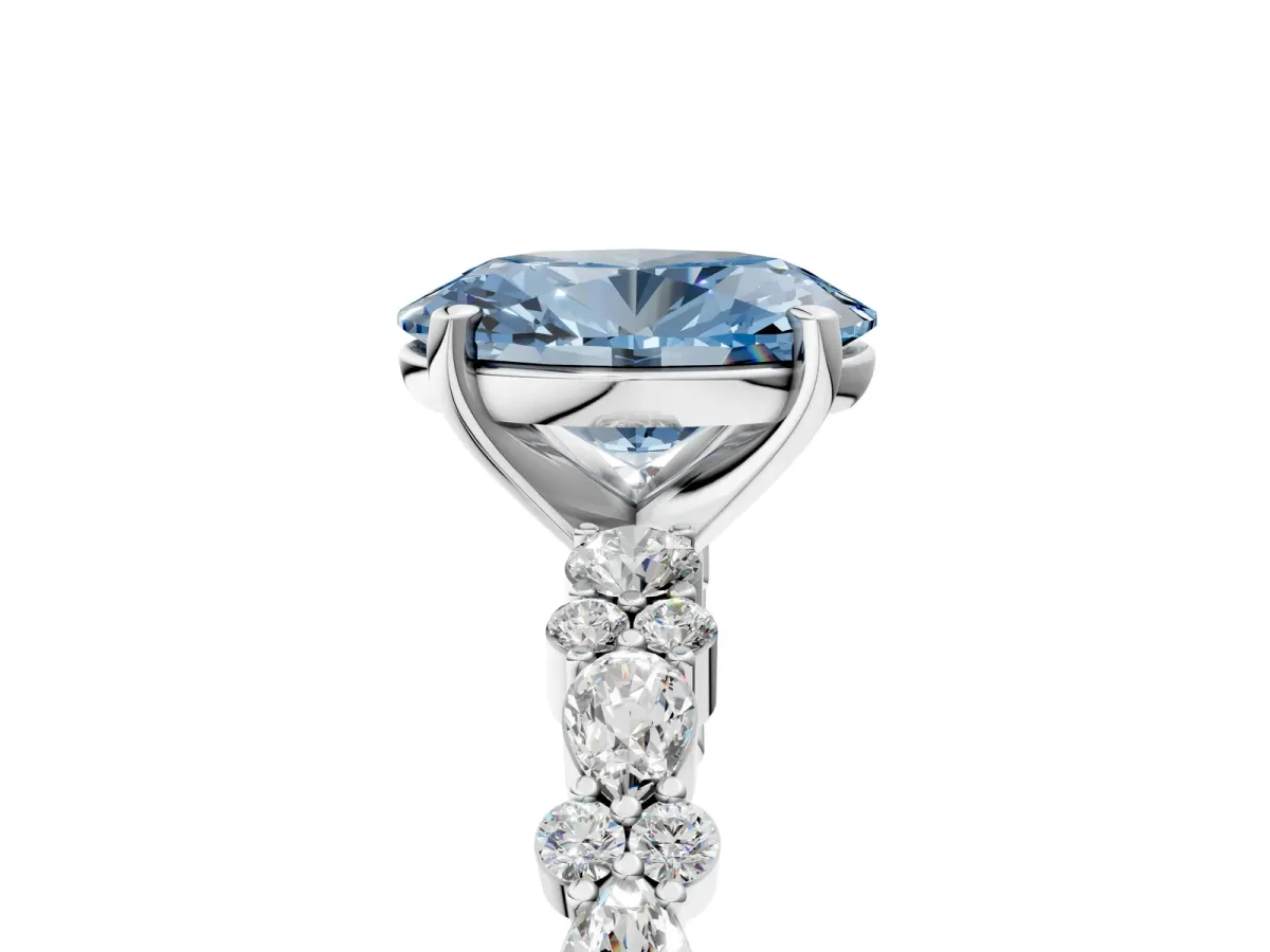 Fancy Blue Oval Cut Diamond Side Stone Solitaire Ring with Round and Four-Prong Setting Platinum