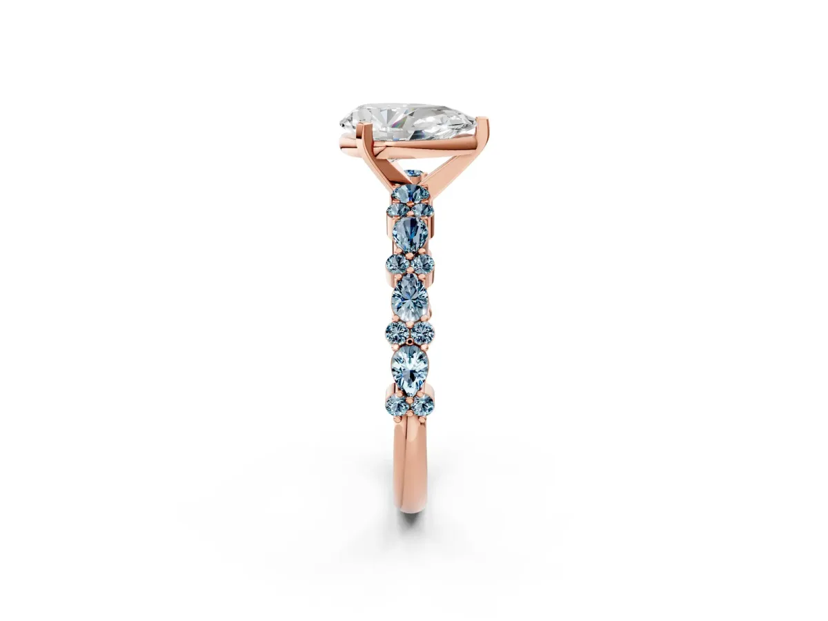 Pear Cut Diamond Side Stone Solitaire Ring with Round Aquamarine and Four-Prong Setting Rose gold