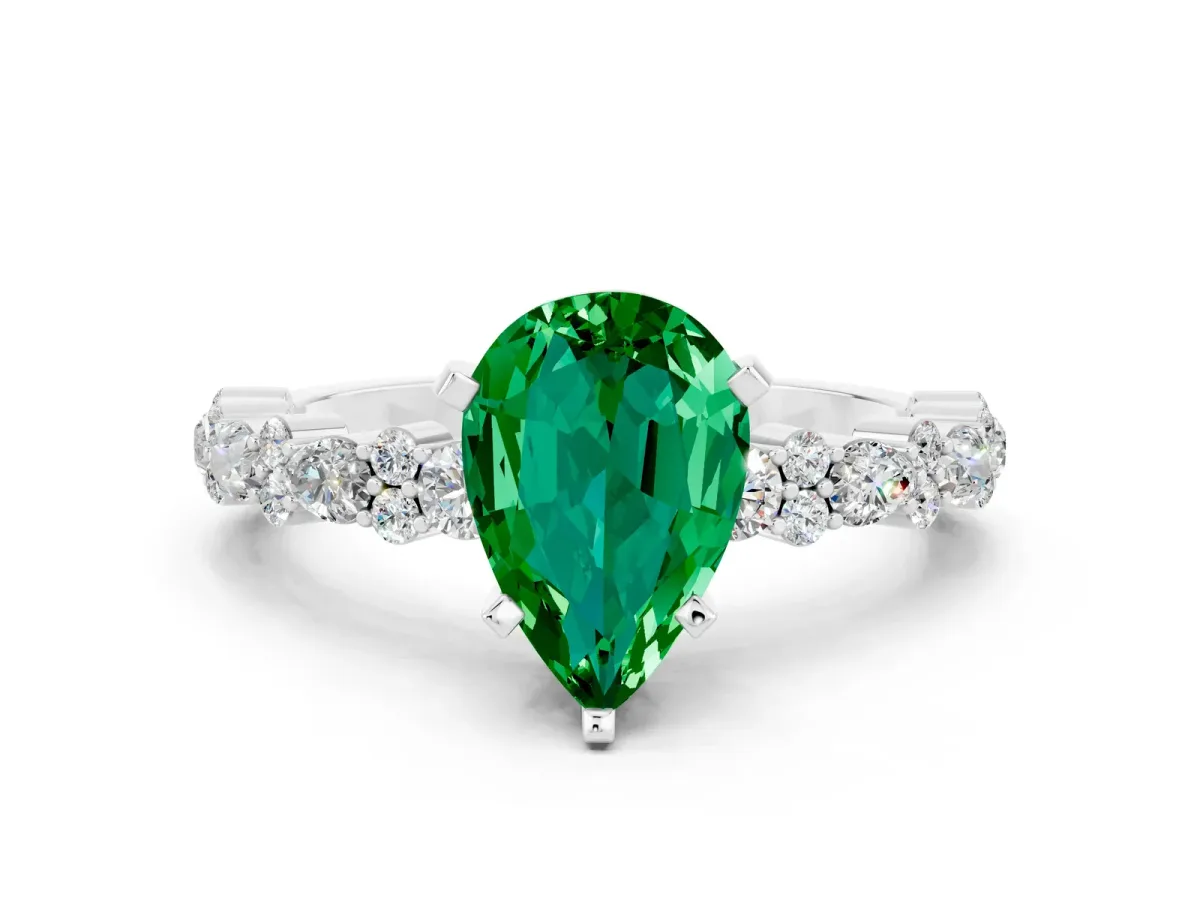 Pear Cut Emerald Side Stone Solitaire Ring with Round and Four-Prong Setting White gold