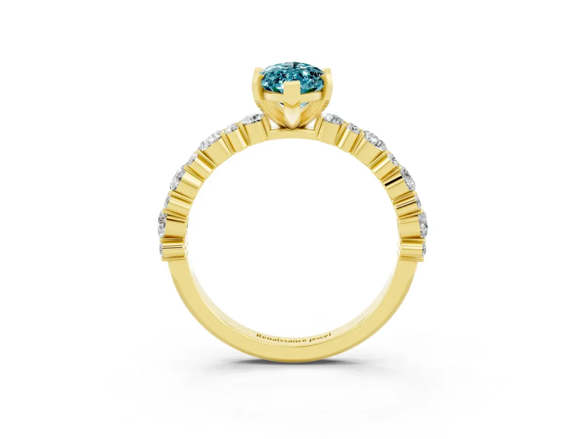 Marquise Cut Blue Topaz Side Stone Solitaire Ring with Round and Four-Prong Setting Yellow gold