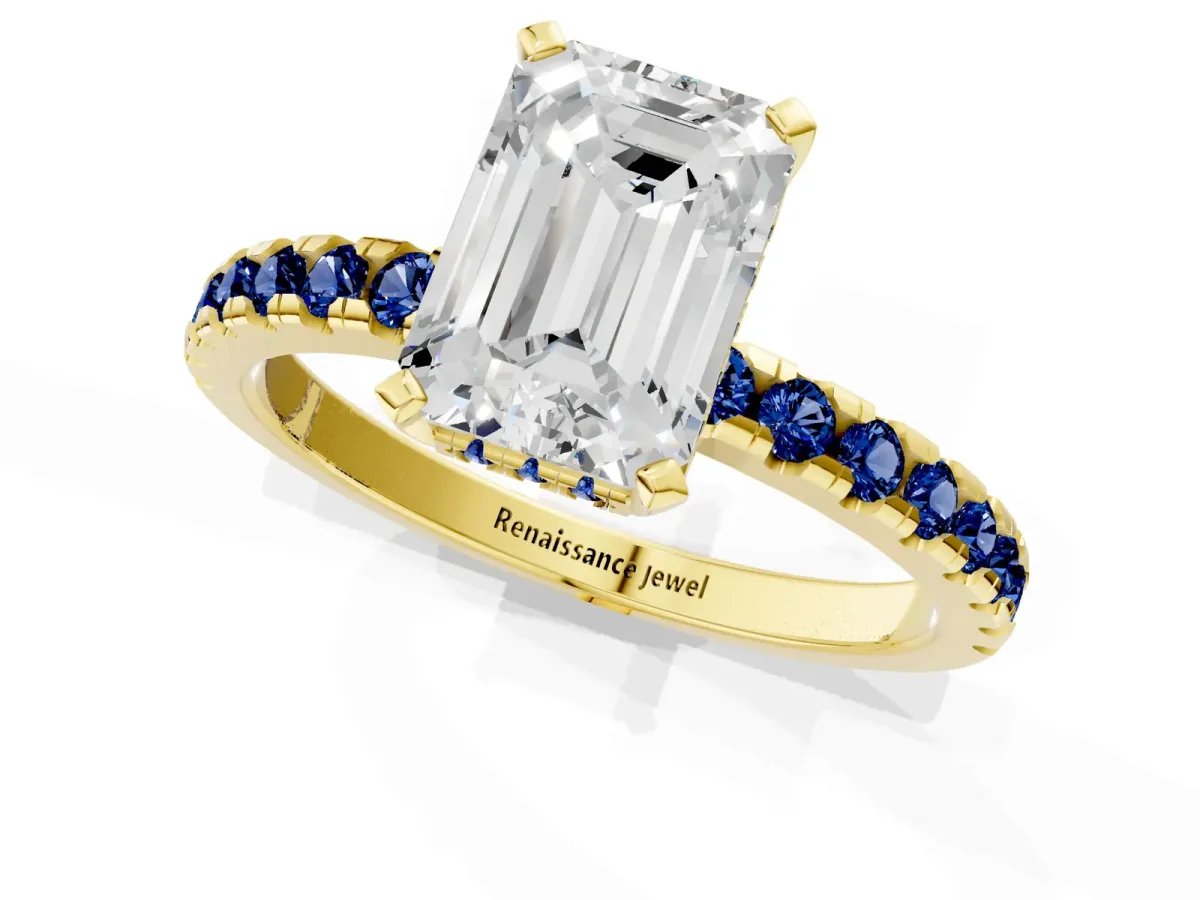 Emerald Cut Diamond Solitaire Ring with Round Blue Sapphire Pavé Band and Four-Prong Setting Yellow gold