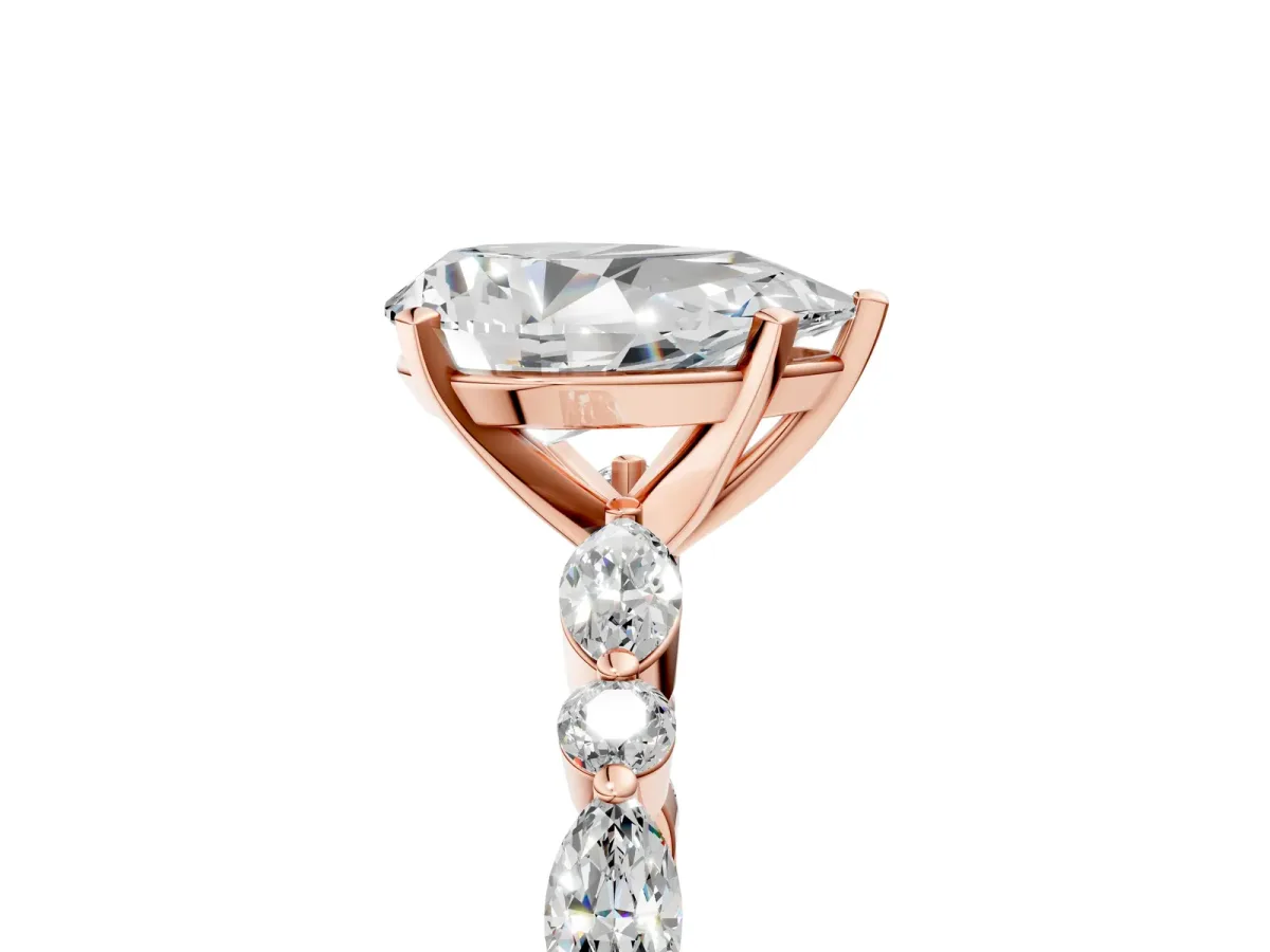 Pear Cut Diamond Ring with Marquise and Round Side Stones and Four-Prong Setting Rose gold