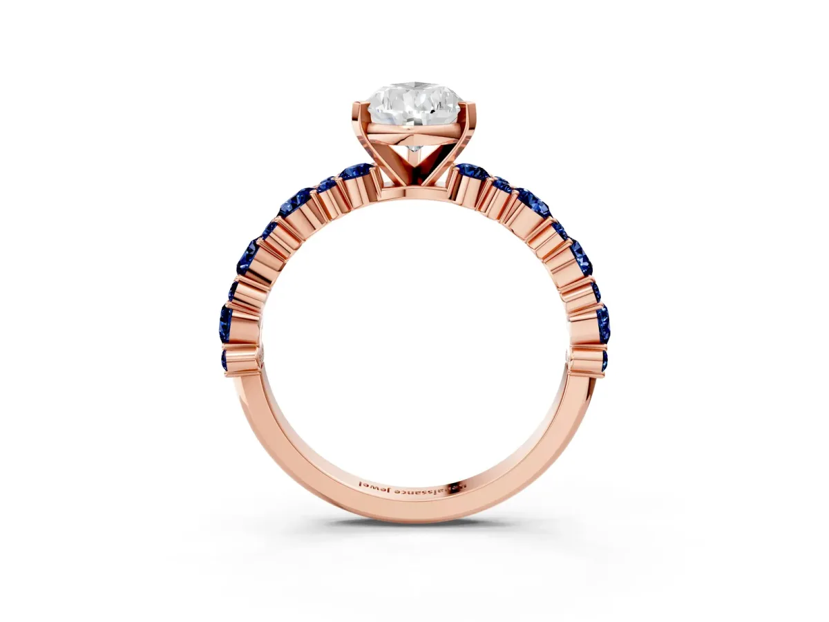 Pear Cut Diamond Side Stone Solitaire Ring with Round Blue Sapphire and Four-Prong Setting Rose gold