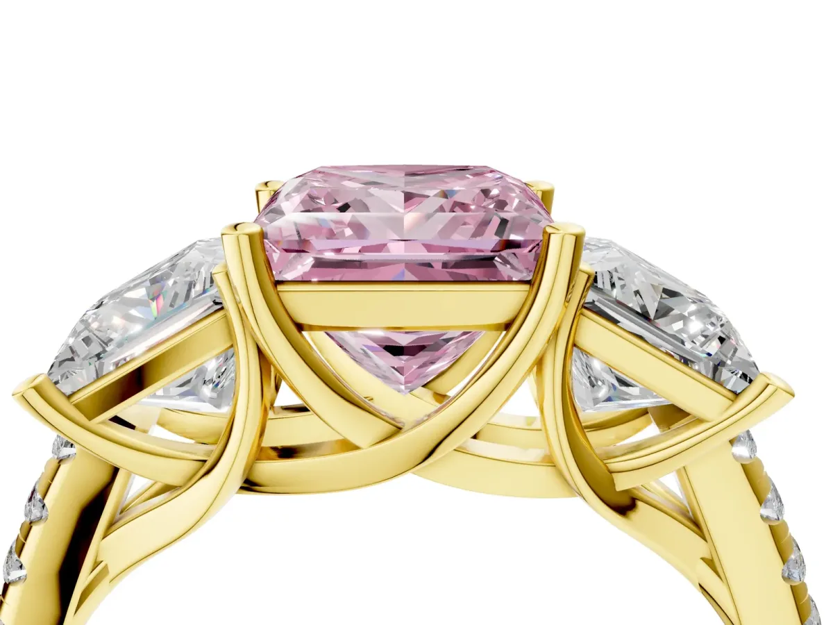 Fancy Pink Three-Stone Princess Cut Diamond Ring with Round Pavé Band and Prong Setting Yellow gold