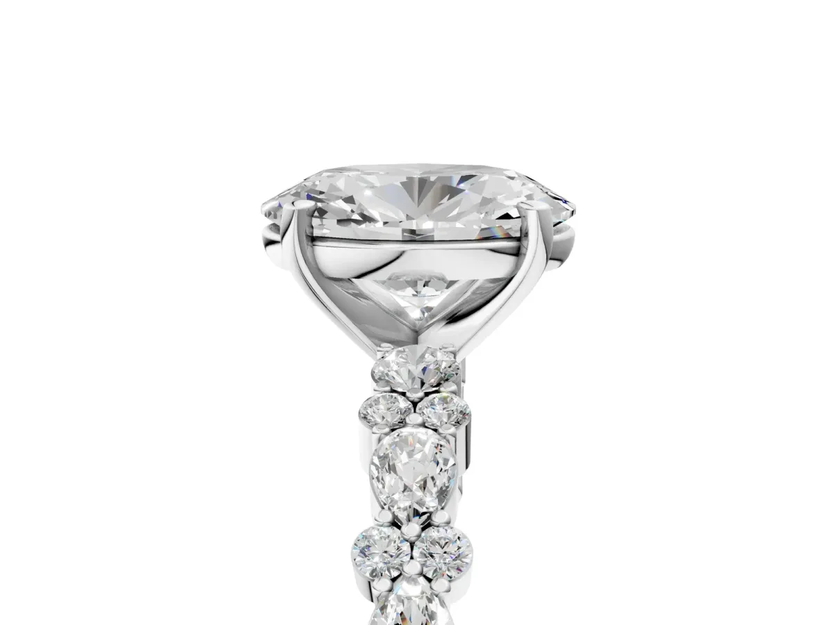 Oval Cut Diamond Side Stone Solitaire Ring with Round and Four-Prong Setting Platinum
