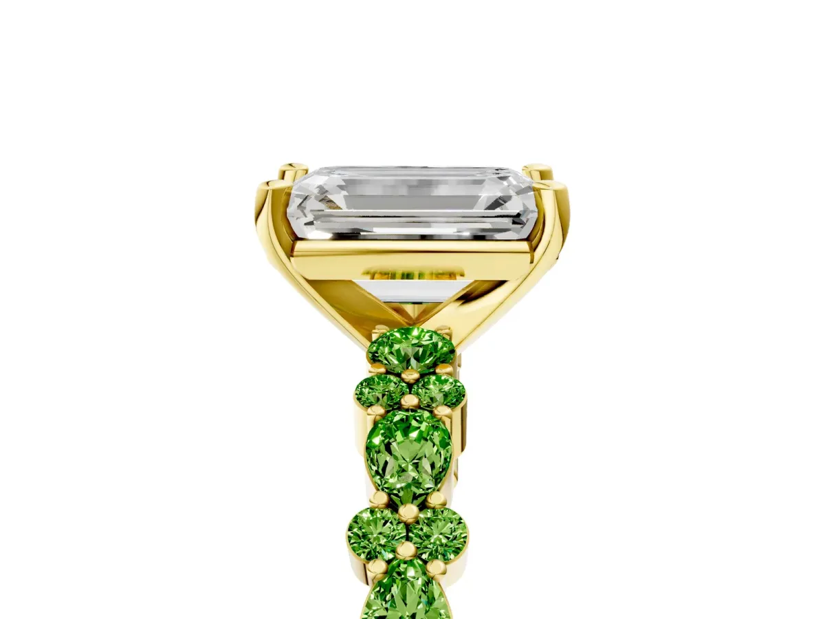 Emerald Cut Diamond Side Stone Solitaire Ring with Round Peridot and Four-Prong Setting Yellow gold
