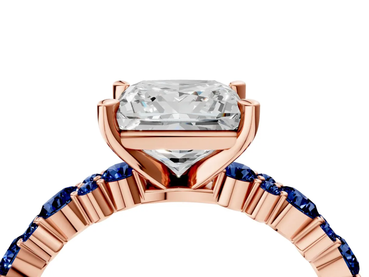 Princess Cut Diamond Side Stone Solitaire Ring with Round Blue Sapphire and Four-Prong Setting Rose gold