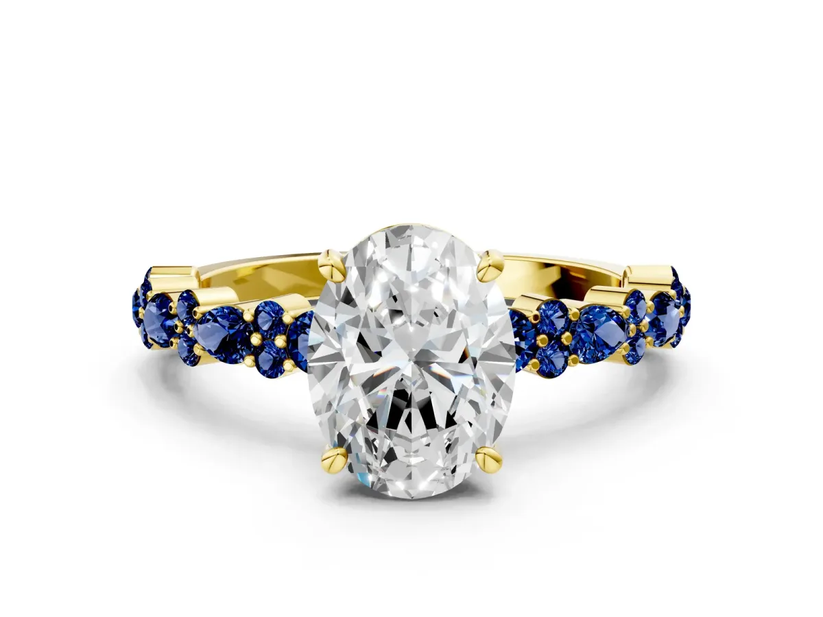 Oval Cut Diamond Side Stone Solitaire Ring with Round Blue Sapphire and Four-Prong Setting Yellow gold