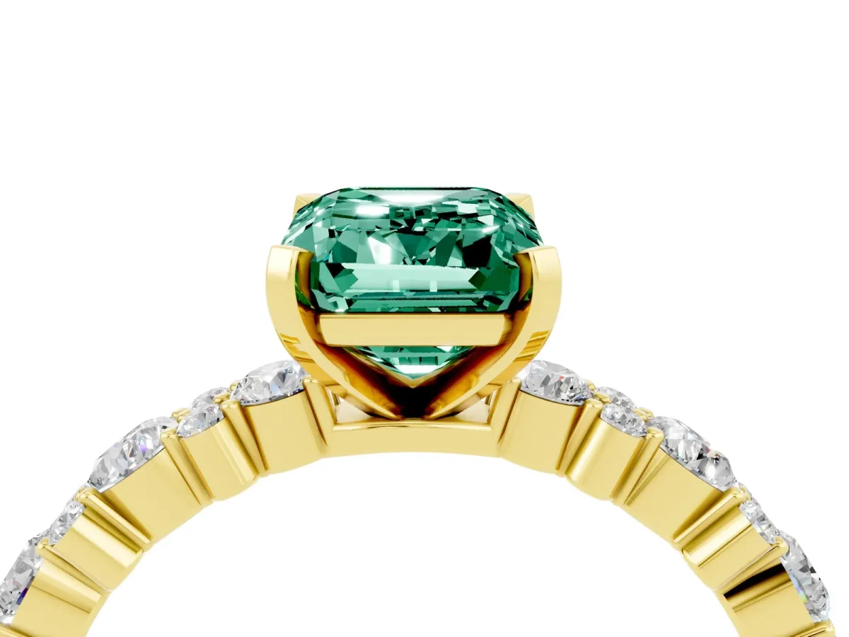 Emerald Cut Green Sapphire Side Stone Solitaire Ring with Round and Four-Prong Setting Yellow gold