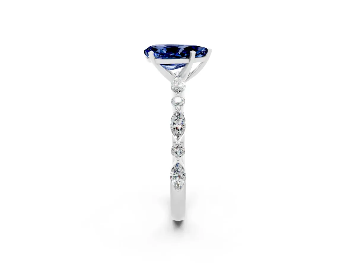 Pear Cut Blue Sapphire Ring with Marquise and Round Side Stones and Four-Prong Setting Silver