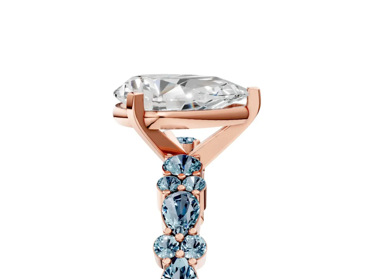 Pear Cut Diamond Side Stone Solitaire Ring with Round Aquamarine and Four-Prong Setting Rose gold