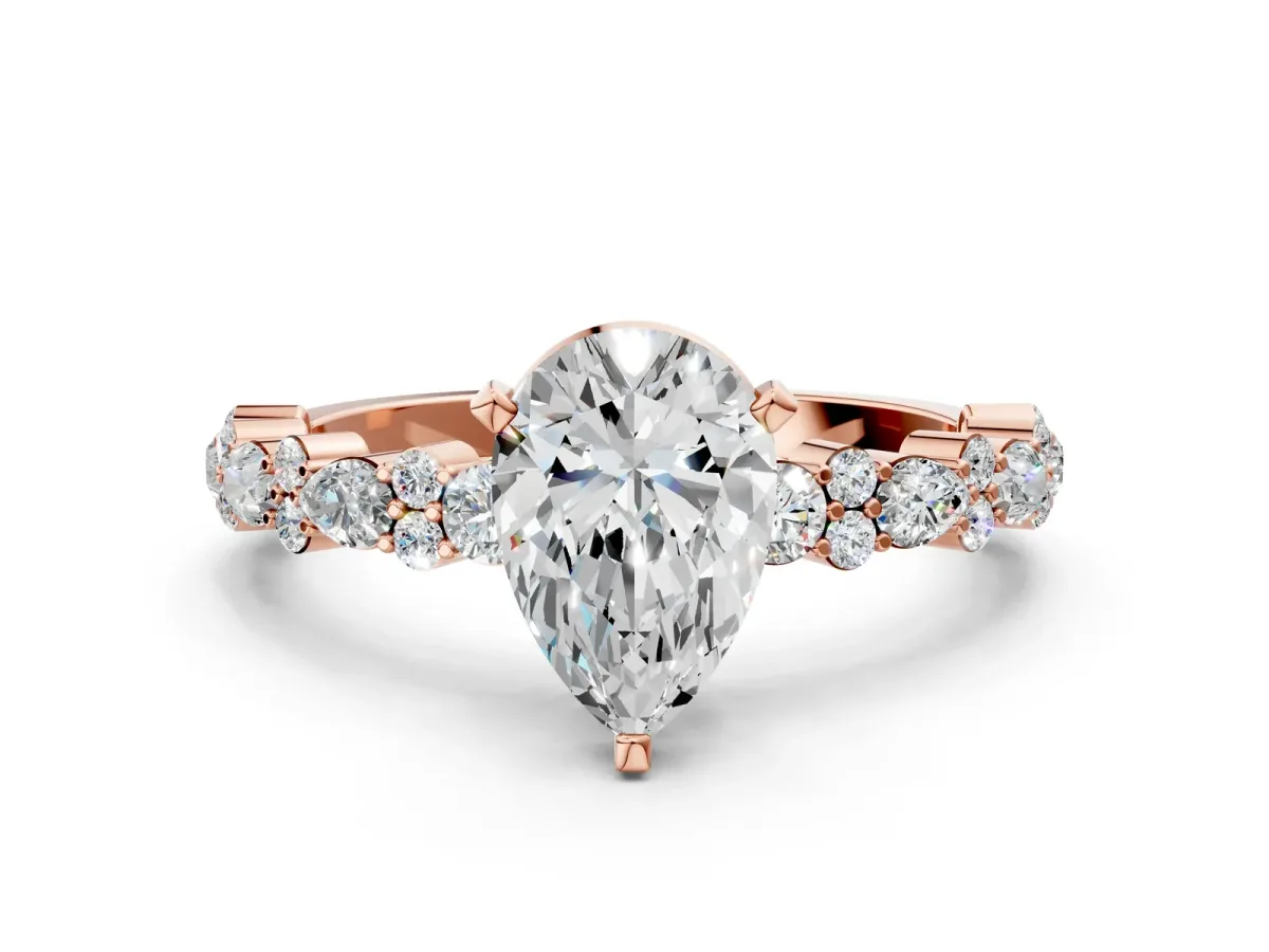 Pear Cut Diamond Side Stone Solitaire Ring with Round Moissanite and Four-Prong Setting Rose gold