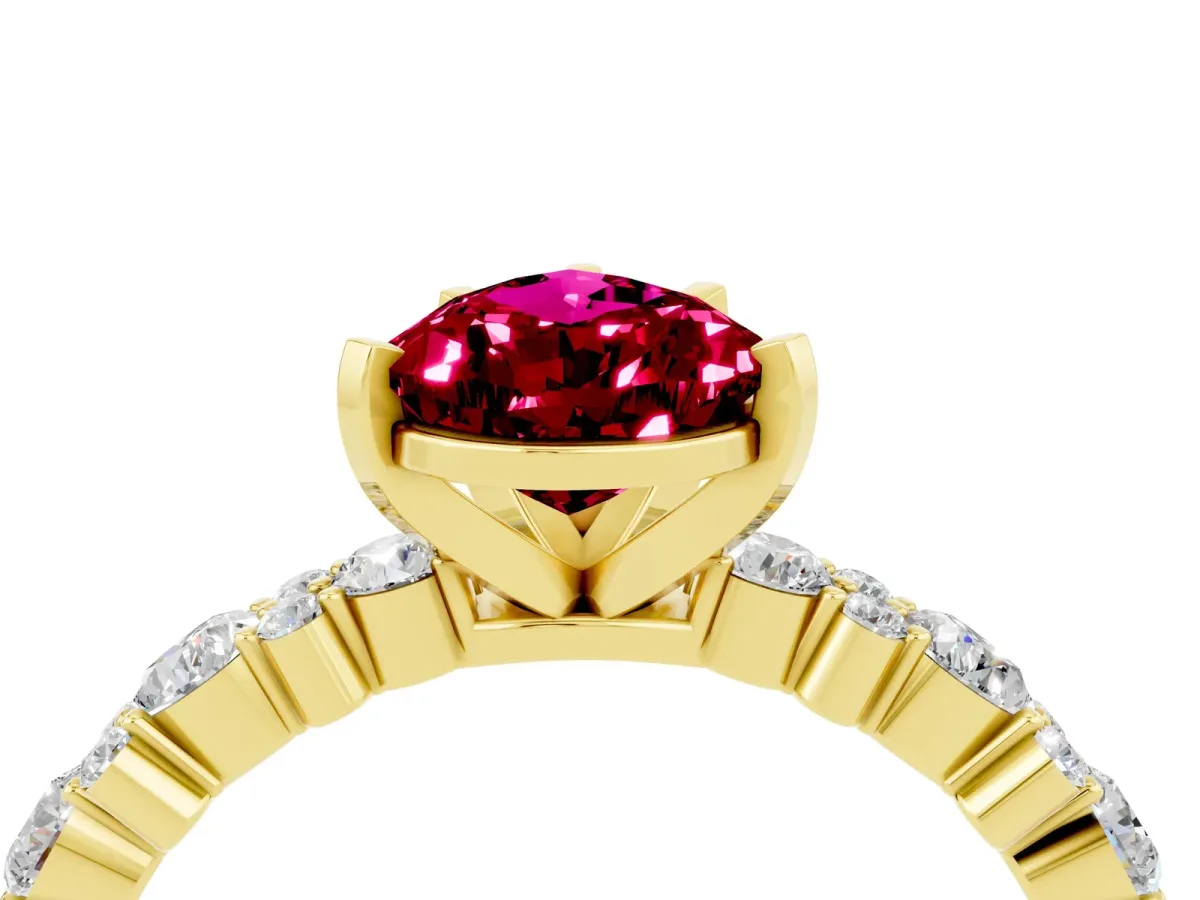 Pear Cut Garnet Side Stone Solitaire Ring with Round and Four-Prong Setting Yellow gold