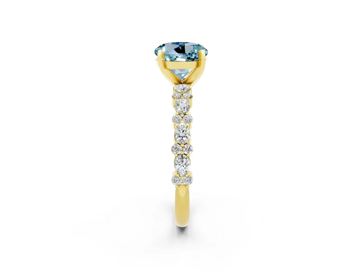 Round Cut Aquamarine Side Stone Solitaire Ring with Round and Four-Prong Setting Yellow gold