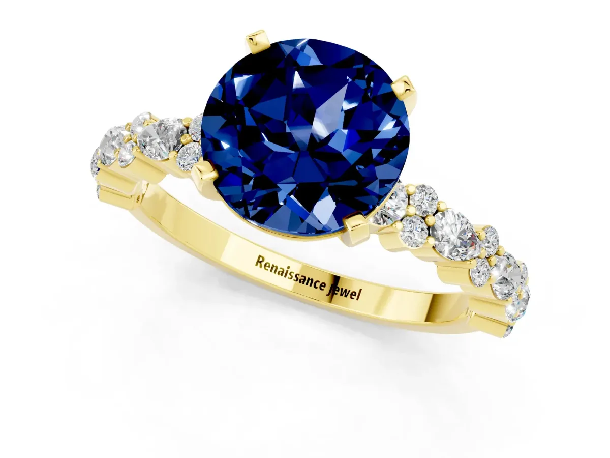 Round Cut Blue Sapphire Side Stone Solitaire Ring with Round and Four-Prong Setting Yellow gold