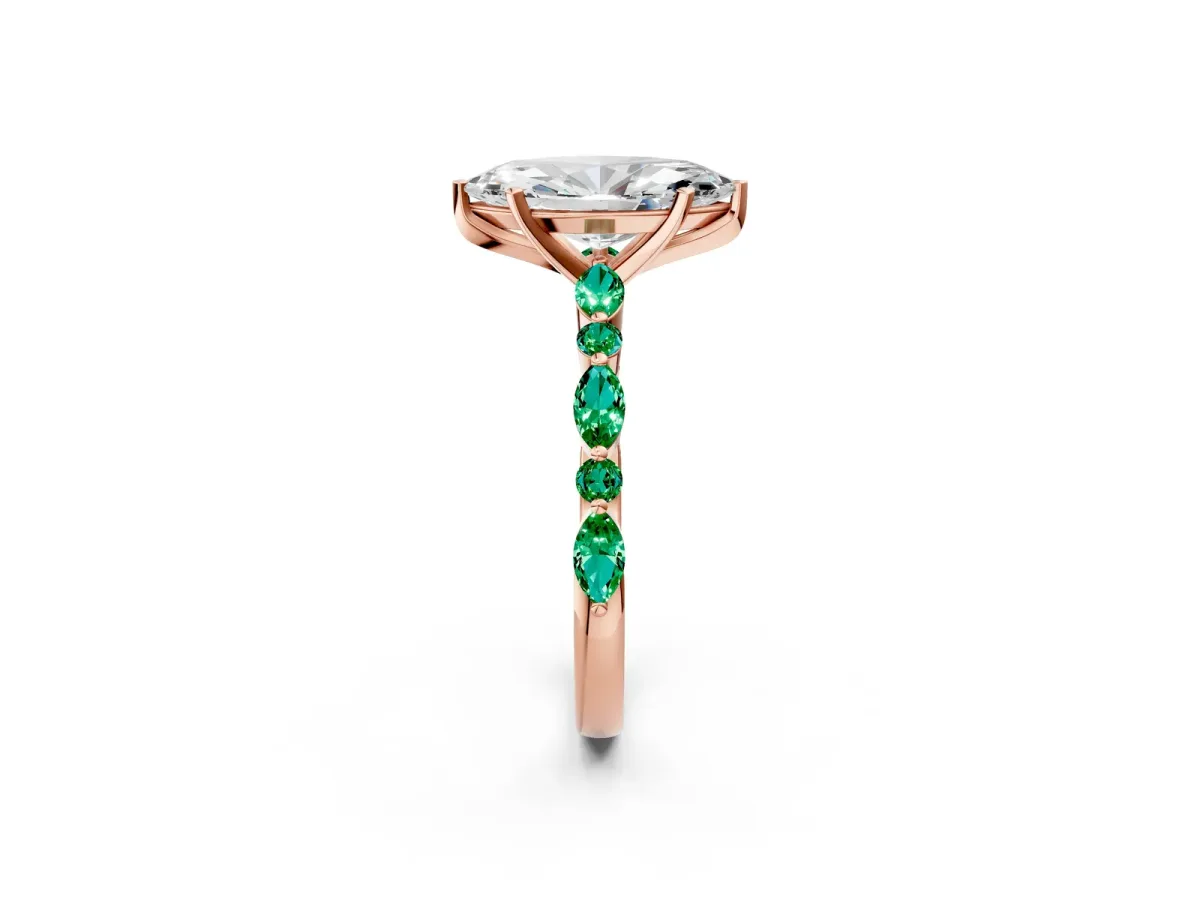 Marquise Cut Diamond Ring with Marquise and Round Emerald Side Stones and Four-Prong Setting Rose gold
