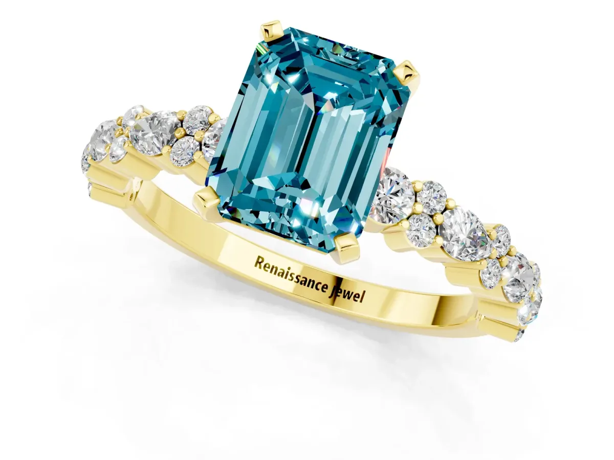 Emerald Cut Blue Topaz Side Stone Solitaire Ring with Round and Four-Prong Setting Yellow gold