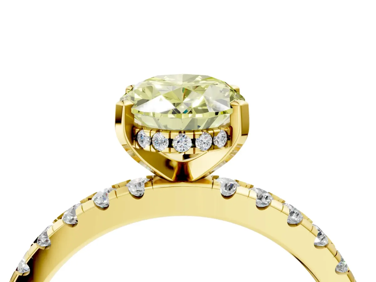Fancy Yellow Oval Cut Diamond Solitaire Ring with Round Pavé Band and Four-Prong Setting Yellow gold