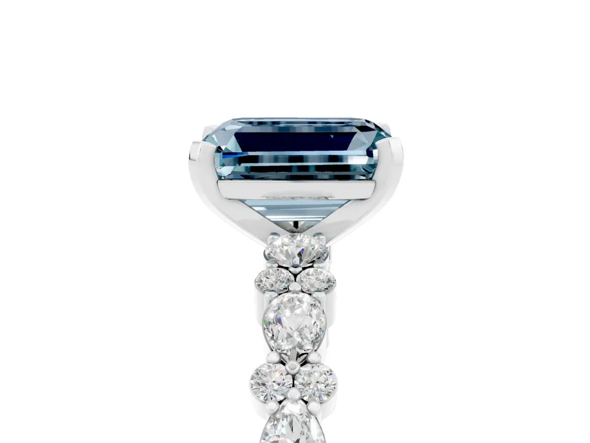 Emerald Cut Aquamarine Side Stone Solitaire Ring with Round and Four-Prong Setting White gold