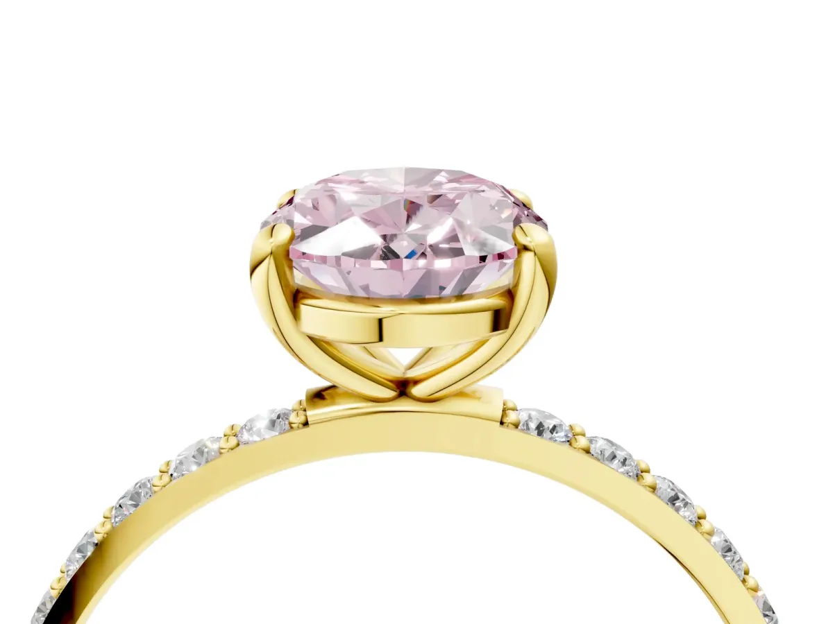 Fancy Pink Oval Cut Diamond Solitaire Ring with Round Pavé Band and Prong Setting Yellow gold