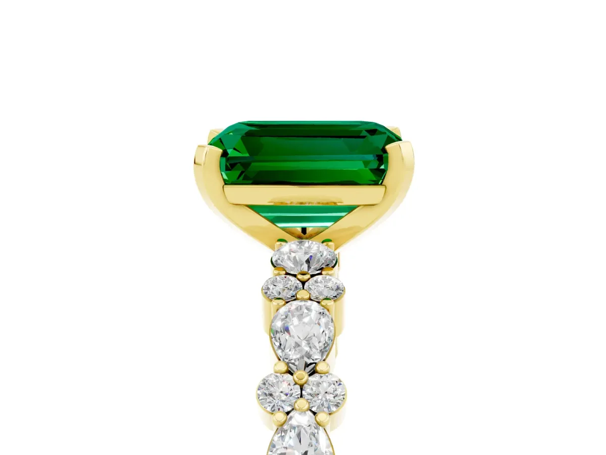 Emerald Cut Emerald Side Stone Solitaire Ring with Round and Four-Prong Setting Yellow gold