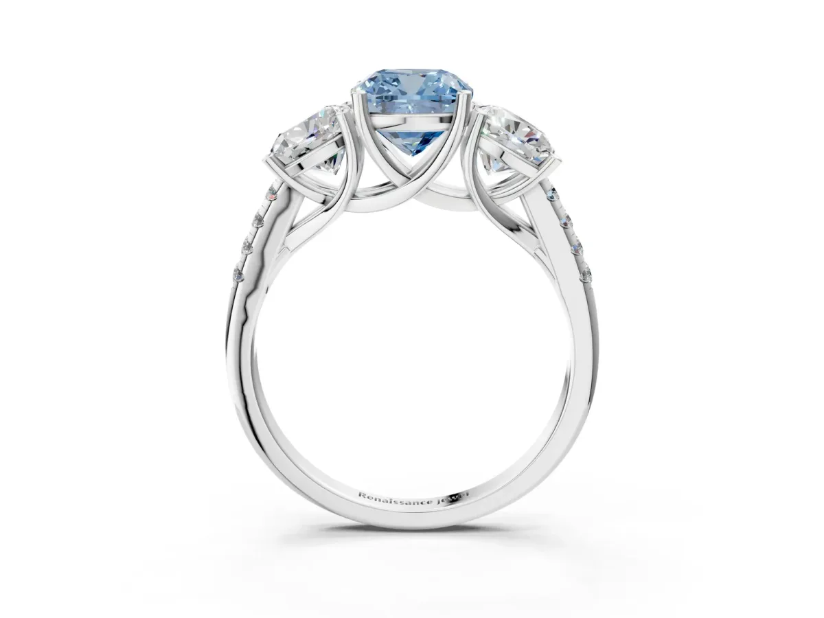 Fancy Blue Three-Stone Cushion Cut Diamond Ring with Round Pavé Band and Prong Setting White gold