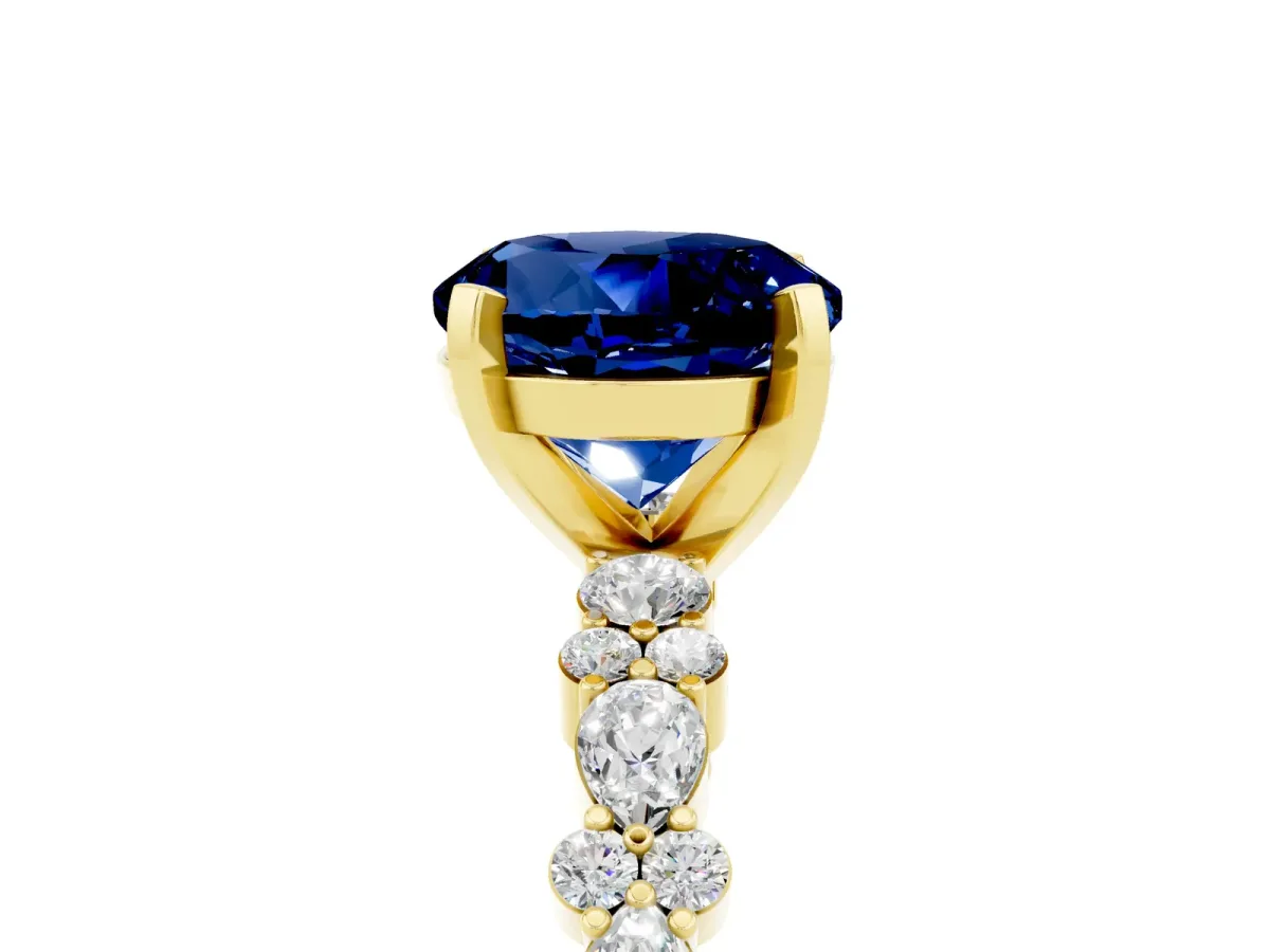 Round Cut Blue Sapphire Side Stone Solitaire Ring with Round and Four-Prong Setting Yellow gold