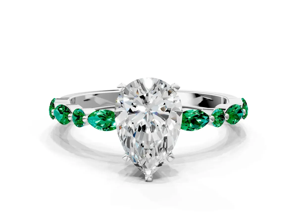 Pear Cut Diamond Ring with Marquise and Round Emerald Side Stones and Four-Prong Setting Silver