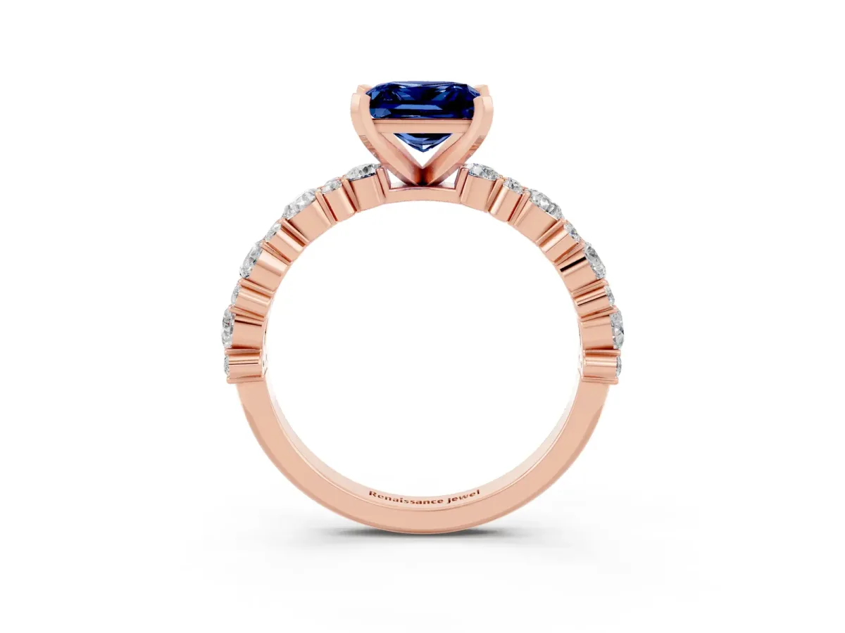 Princess Cut Blue Sapphire Side Stone Solitaire Ring with Round and Four-Prong Setting Rose gold