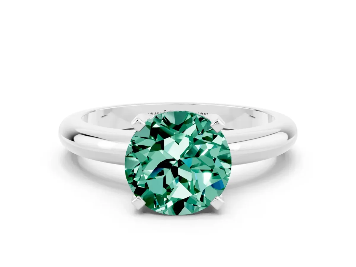 Round Cut Green Sapphire Solitaire Engagement Ring with Round Band and Four-Prong Setting Silver