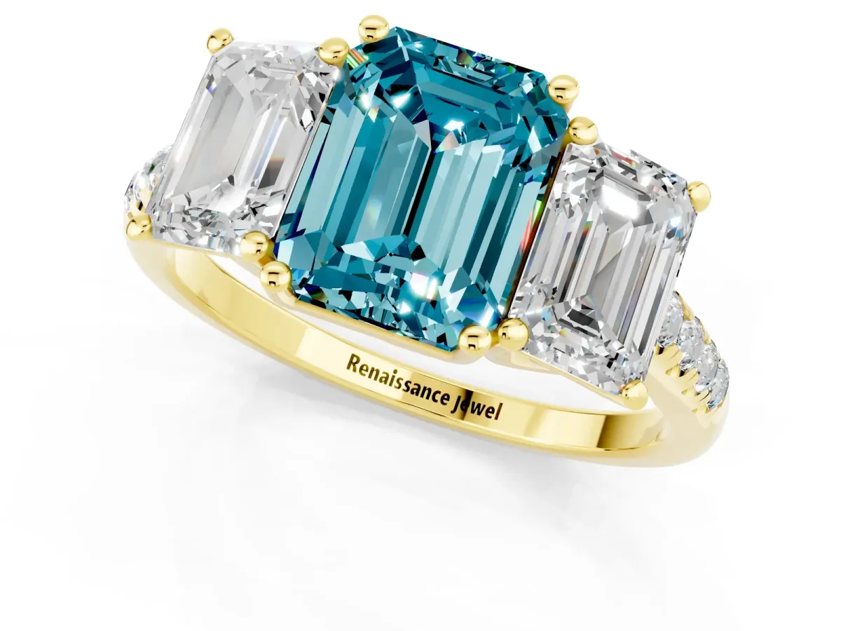 Three-Stone Emerald Cut Blue Topaz Ring with Round Pavé Band and Prong Setting Yellow gold