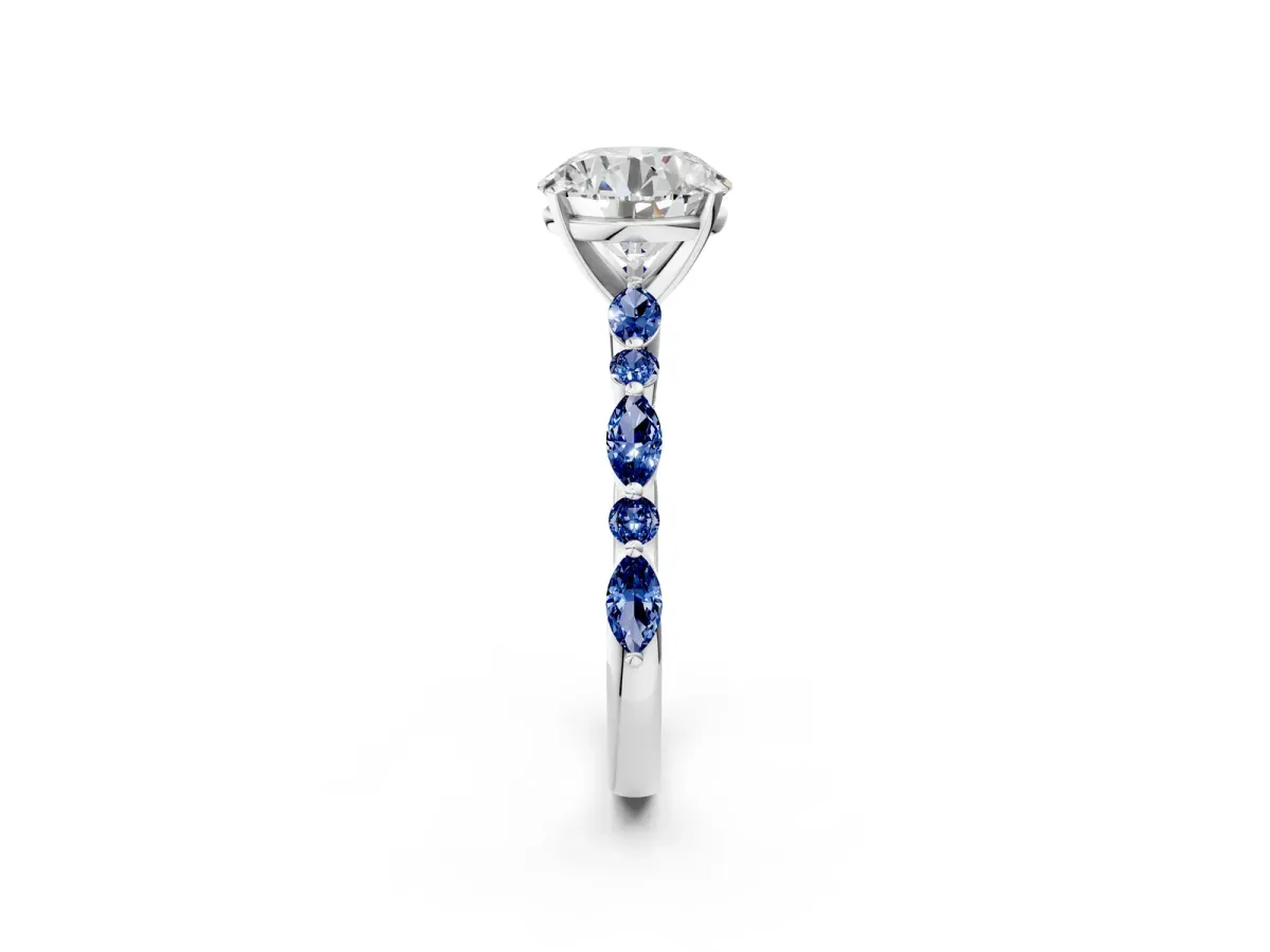Round Cut Diamond Ring with Marquise and Round Blue Sapphire Side Stones and Four-Prong Setting Silver