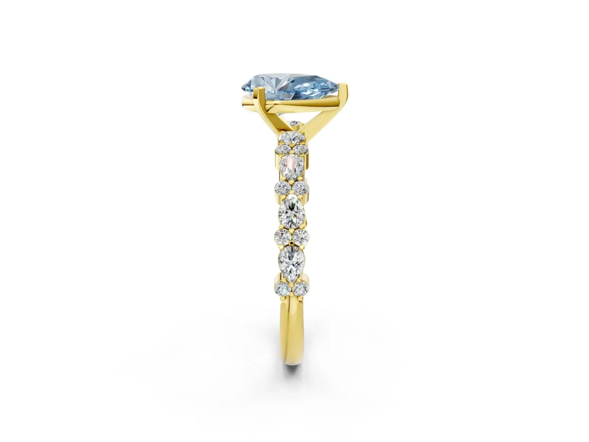Fancy Blue Pear Cut Diamond Side Stone Solitaire Ring with Round and Four-Prong Setting Yellow gold