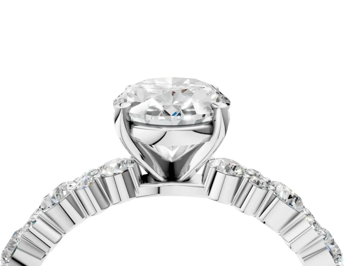 Oval Cut Diamond Side Stone Solitaire Ring with Round and Four-Prong Setting Platinum