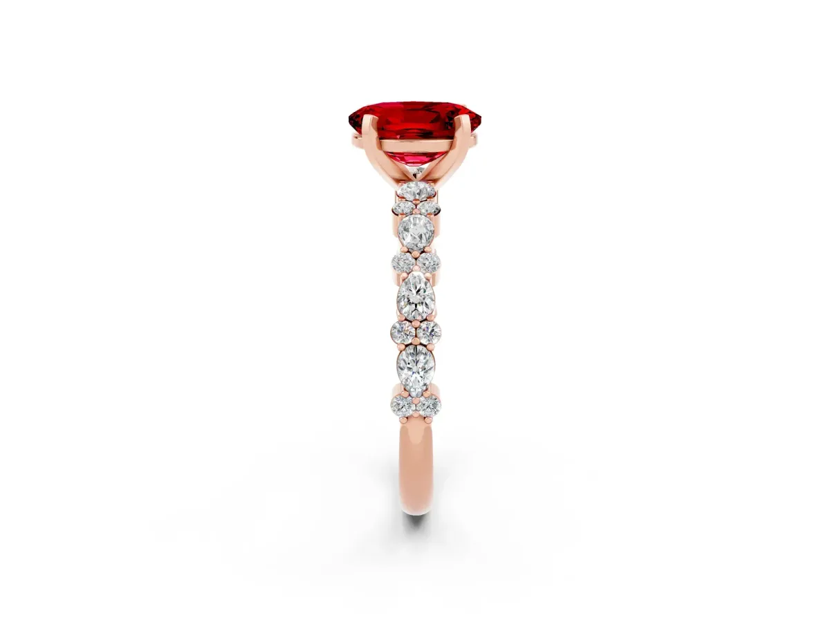 Oval Cut Ruby Side Stone Solitaire Ring with Round and Four-Prong Setting Rose gold
