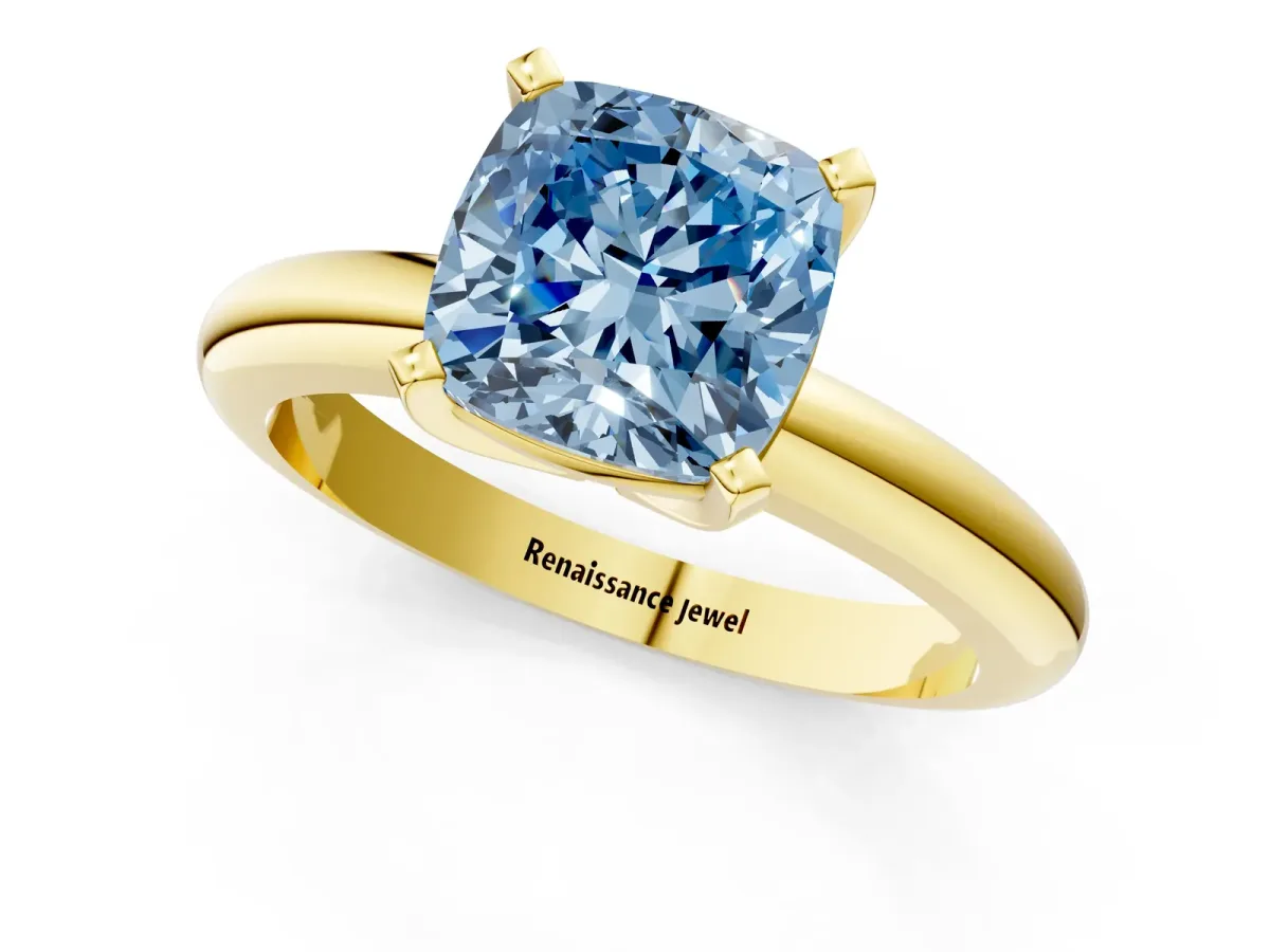 Fancy Blue Cushion Cut Diamond Solitaire Engagement Ring with Round Band and Four-Prong Setting Yellow gold