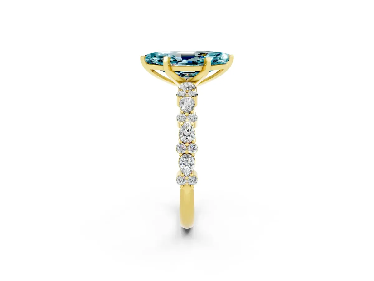 Marquise Cut Blue Topaz Side Stone Solitaire Ring with Round and Four-Prong Setting Yellow gold