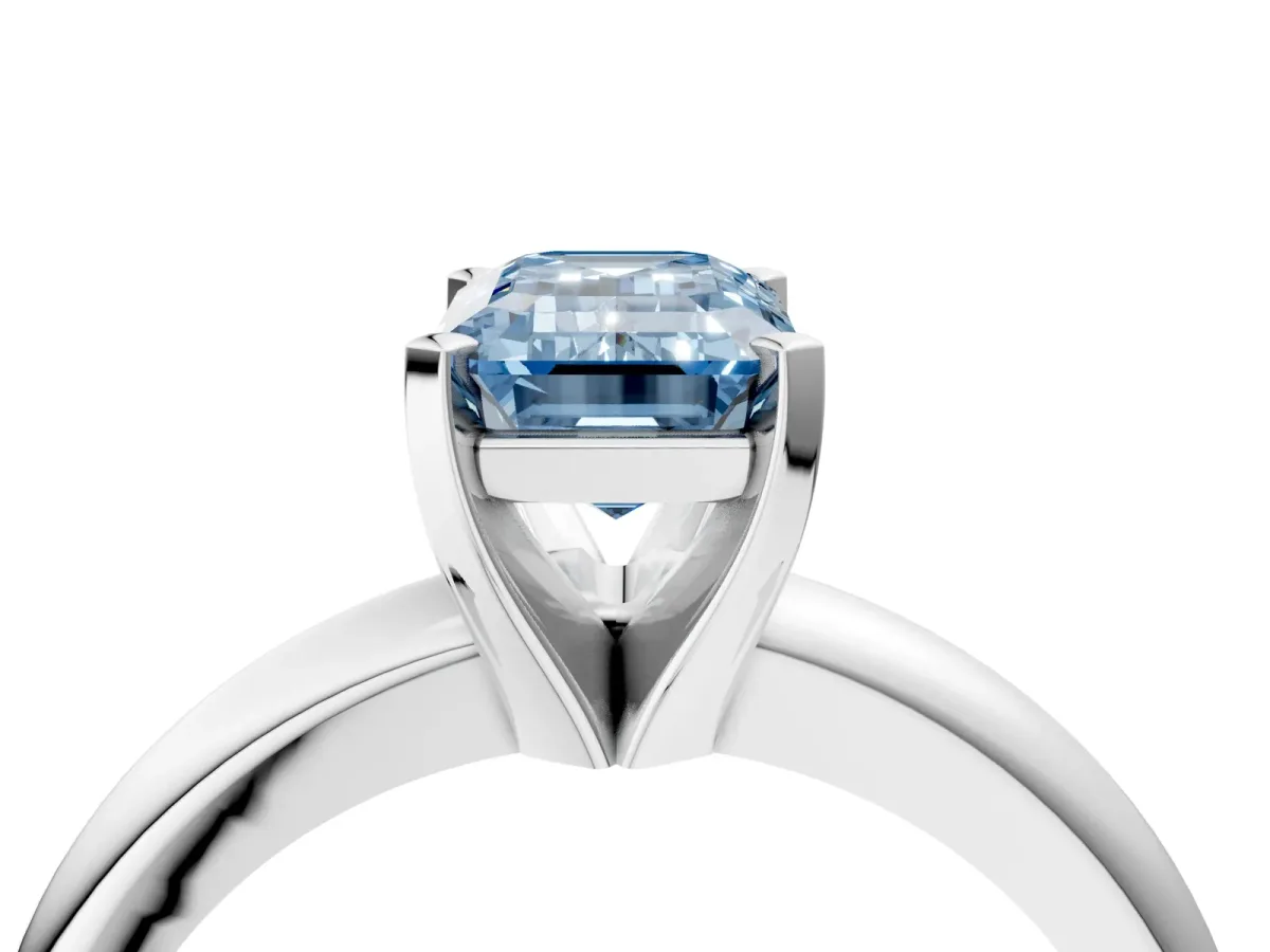Fancy Blue Emerald Cut Diamond Solitaire Engagement Ring with Round Band and Four-Prong Setting White gold